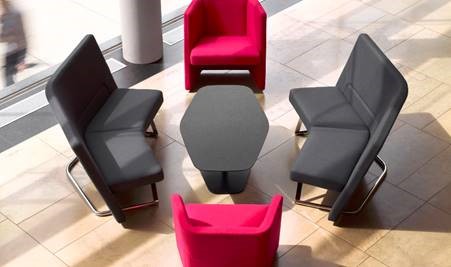 Office furniture that creates a welcoming space, colorful furniture, open floored meeting space