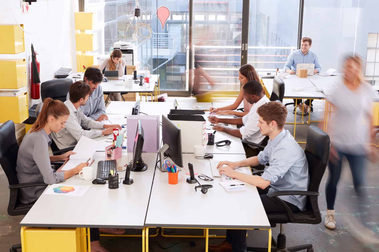 People working at office benches