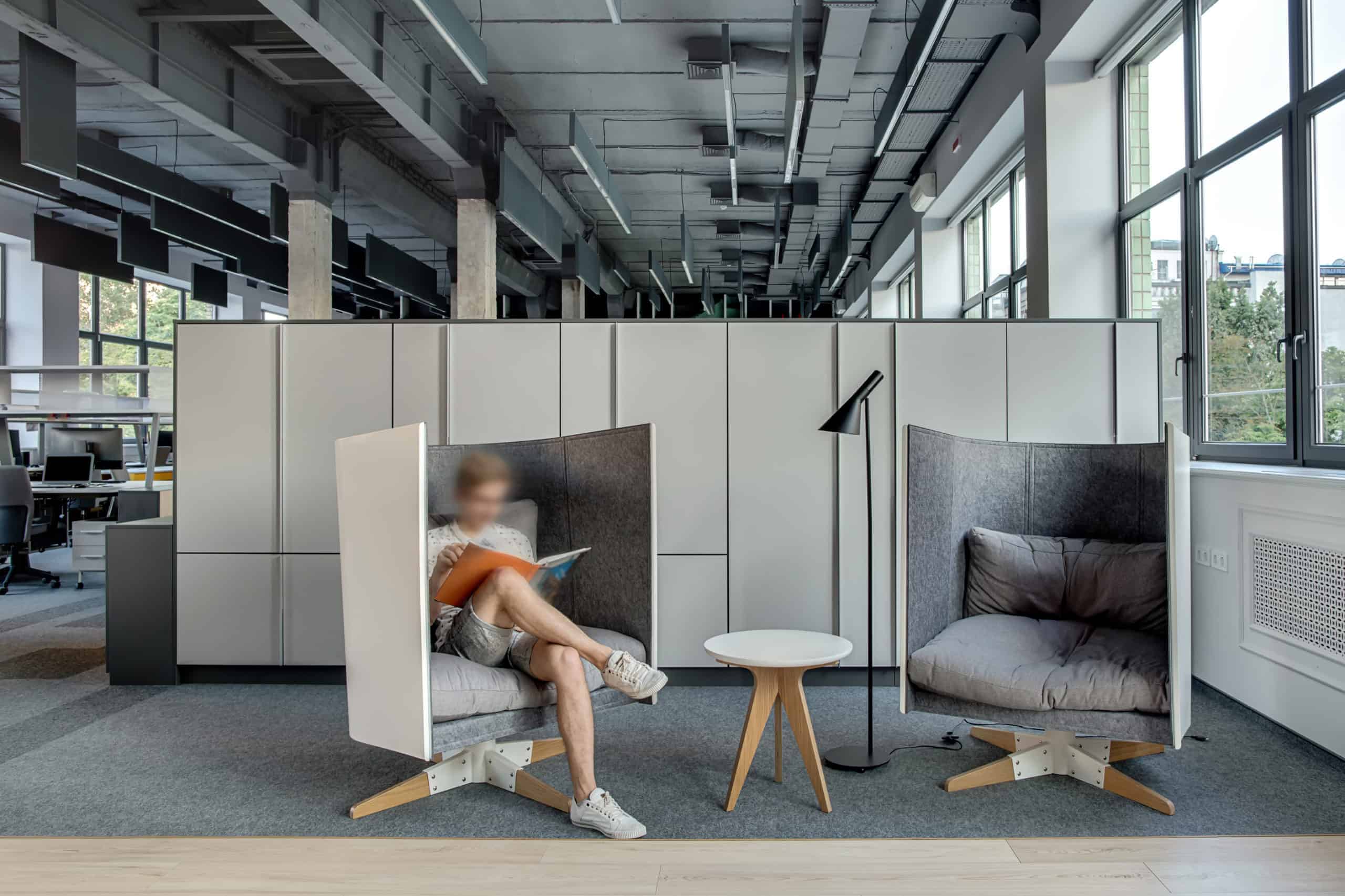 employee sitting in resimercial high back chair