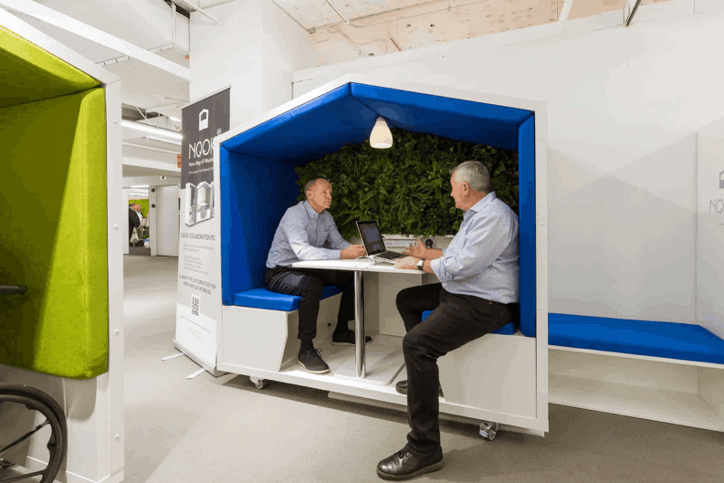 men collaborating in resimercial modular huddle pod