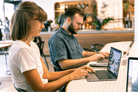 Two people working at desk