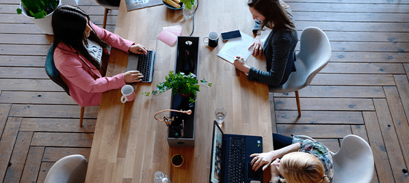 Team working at communal desk